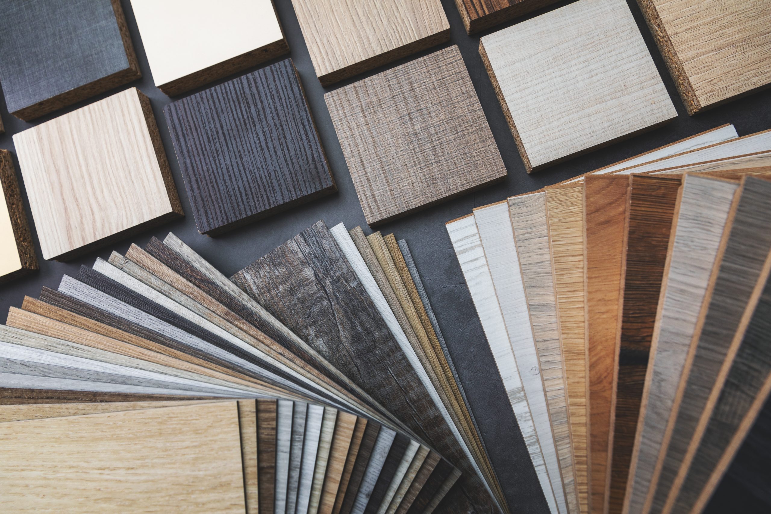 Close-up of assorted timber swatches, highlighting grain and colour differences for buyers comparing wood suppliers